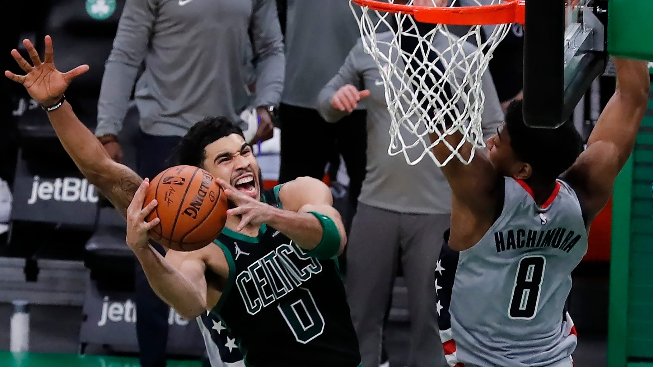 Boston Celtics' Jayson Tatum (0) shoots the go-ahead basket against Washington Wizards' Rui Hachimura (8) during a Feb. 28 win in Boston. The Celtics will face the Wizards tonight in Game 1 of a play-in tourney.