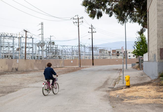 A homeless man rides his bike in Salinas, Calif. [file photo]