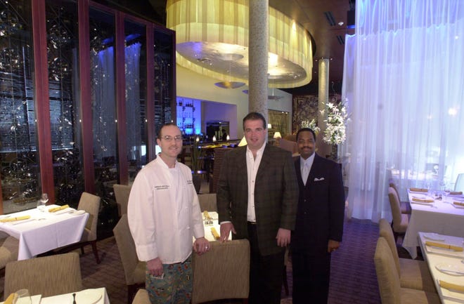 Cameron Mitchell's new restaurant, "M" at Miranova, opens in 2002, attended by executive chef Brian Hinshaw, owner Cameron Mitchell and general manager Walter Carpenter.