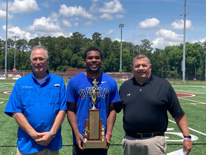 Benedictine senior Trent Broadnax, center, is the recipient of the 68th Ashley Dearing Award, given to the top three-sport male high school athlete in Savannah. At left is Steve Dearing, and at right is Islands High School's Karl DeMasi of the award committee, during the ceremony on Tuesday at Benedictine. The award winner was announced last week.
