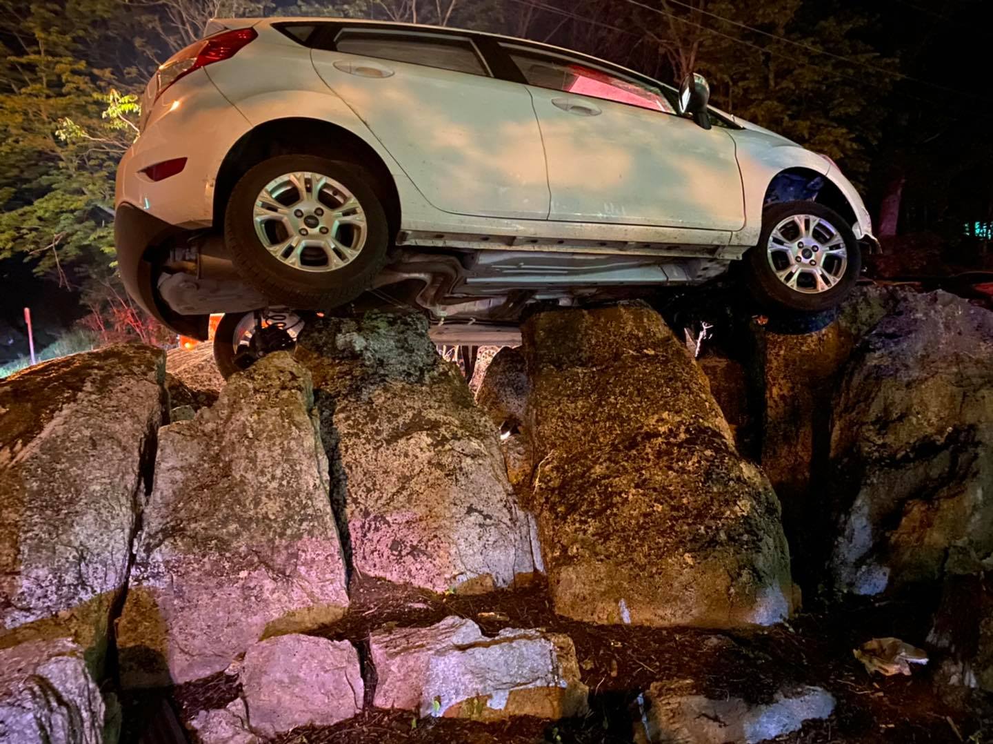 A car landed on a rock formation near a Berkeley County, W.Va., bar
