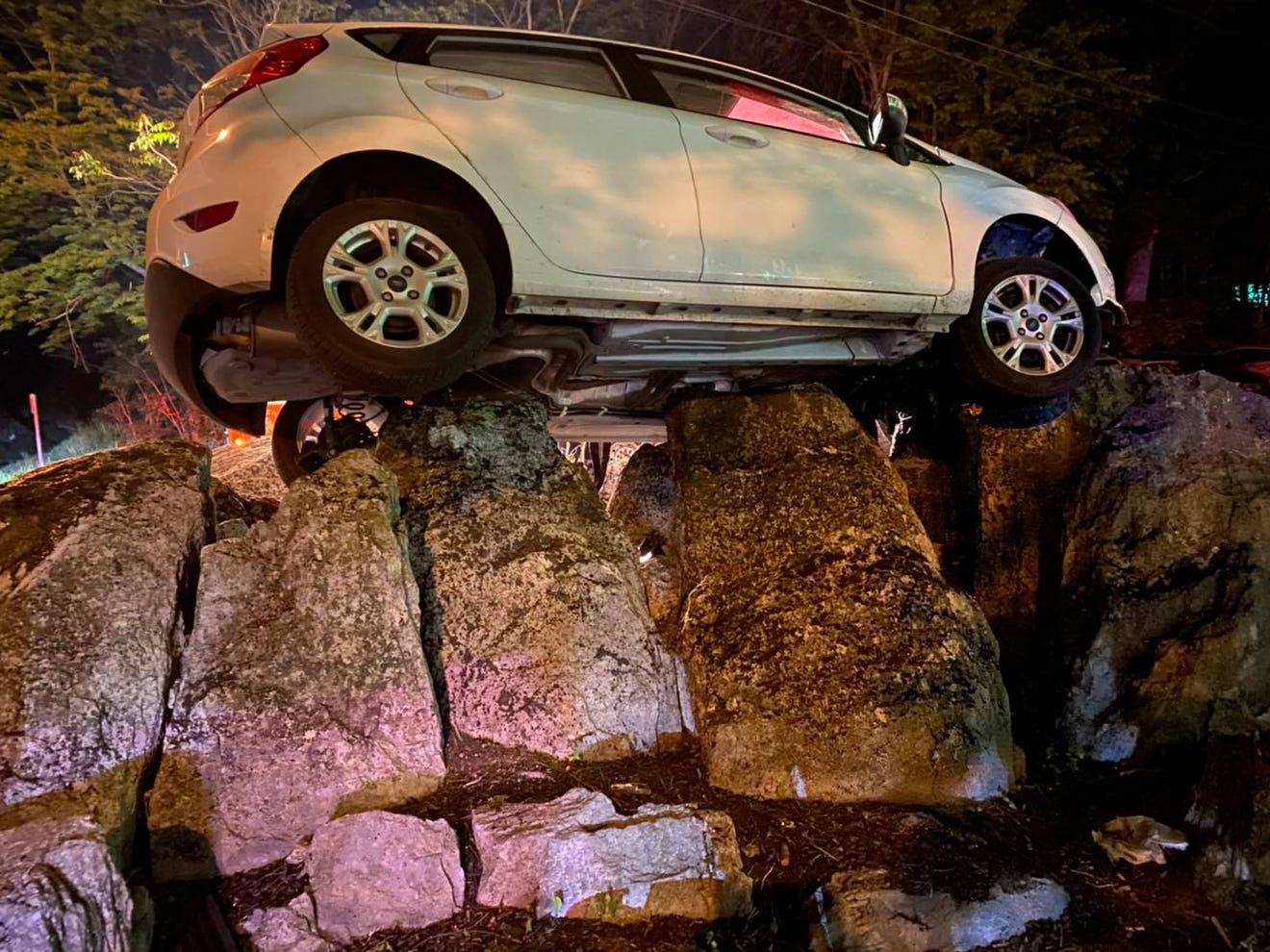 A car landed on a rock formation near a Berkeley County, W.Va., bar