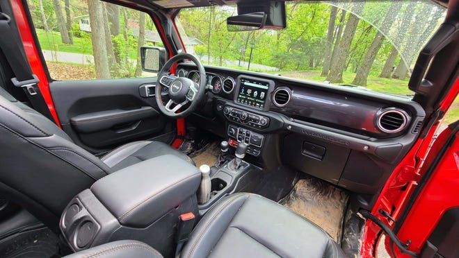 The interior of the 2021 Jeep Wrangler Rubicon 392. UCOnnect screen, automatic tranny. Mud optional.