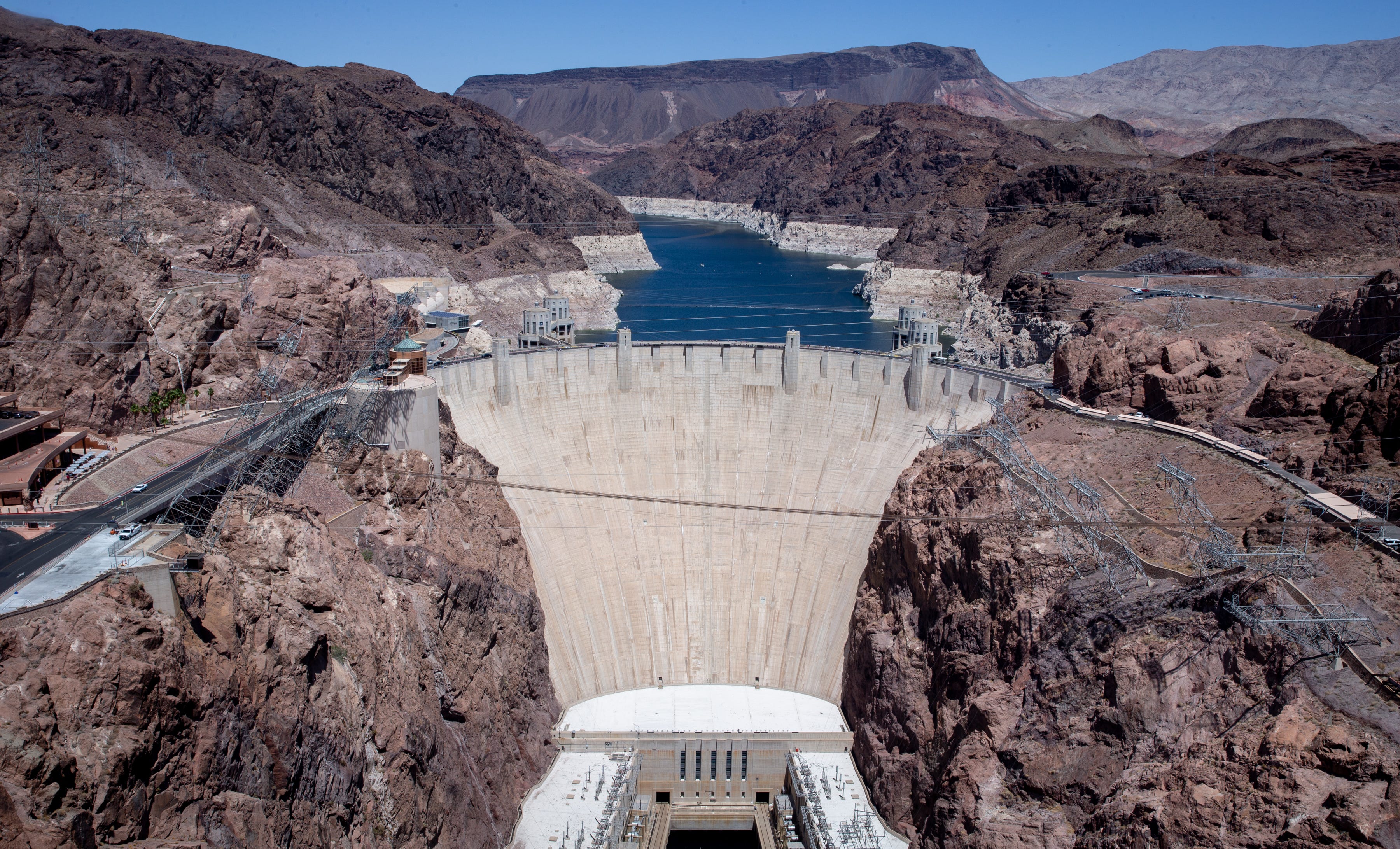 A high-water mark or "bathtub ring" is visible on the shoreline of Lake Mead at Hoover Dam.