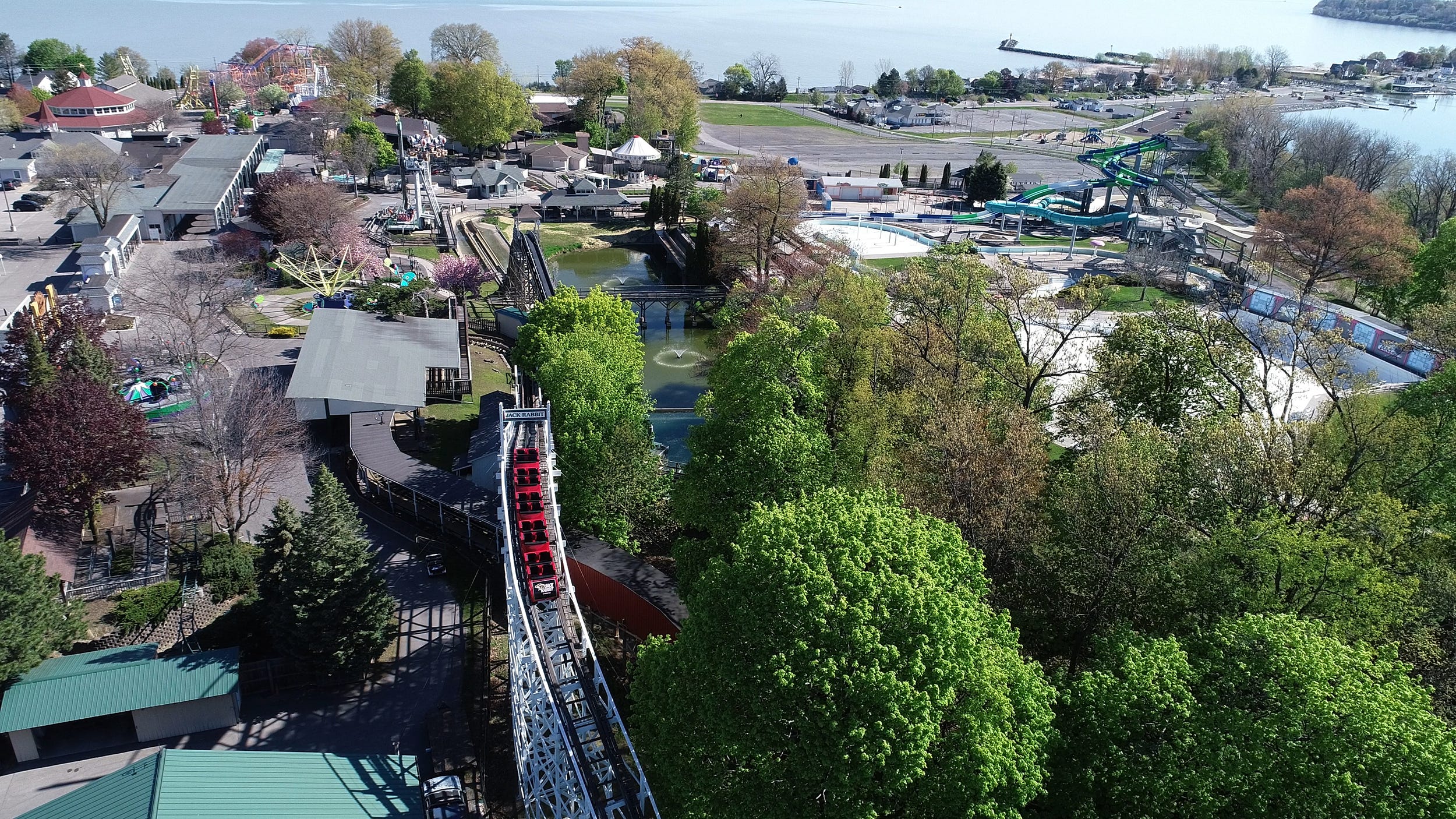 The Jack Rabbit rollercoaster goes up over its highest point with a view of Lake Ontario and part of Irondequoit Bay at Seabreeze Amusement Park in Irondequoit on May 14. The park was closed last year due to COVID-19 and will be open only on weekends until the end of June, when it will be open seven days a week.