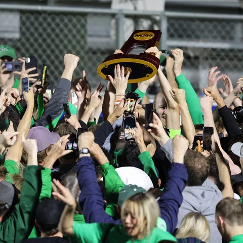 Marshall Thundering Herd fans celebrate with playe