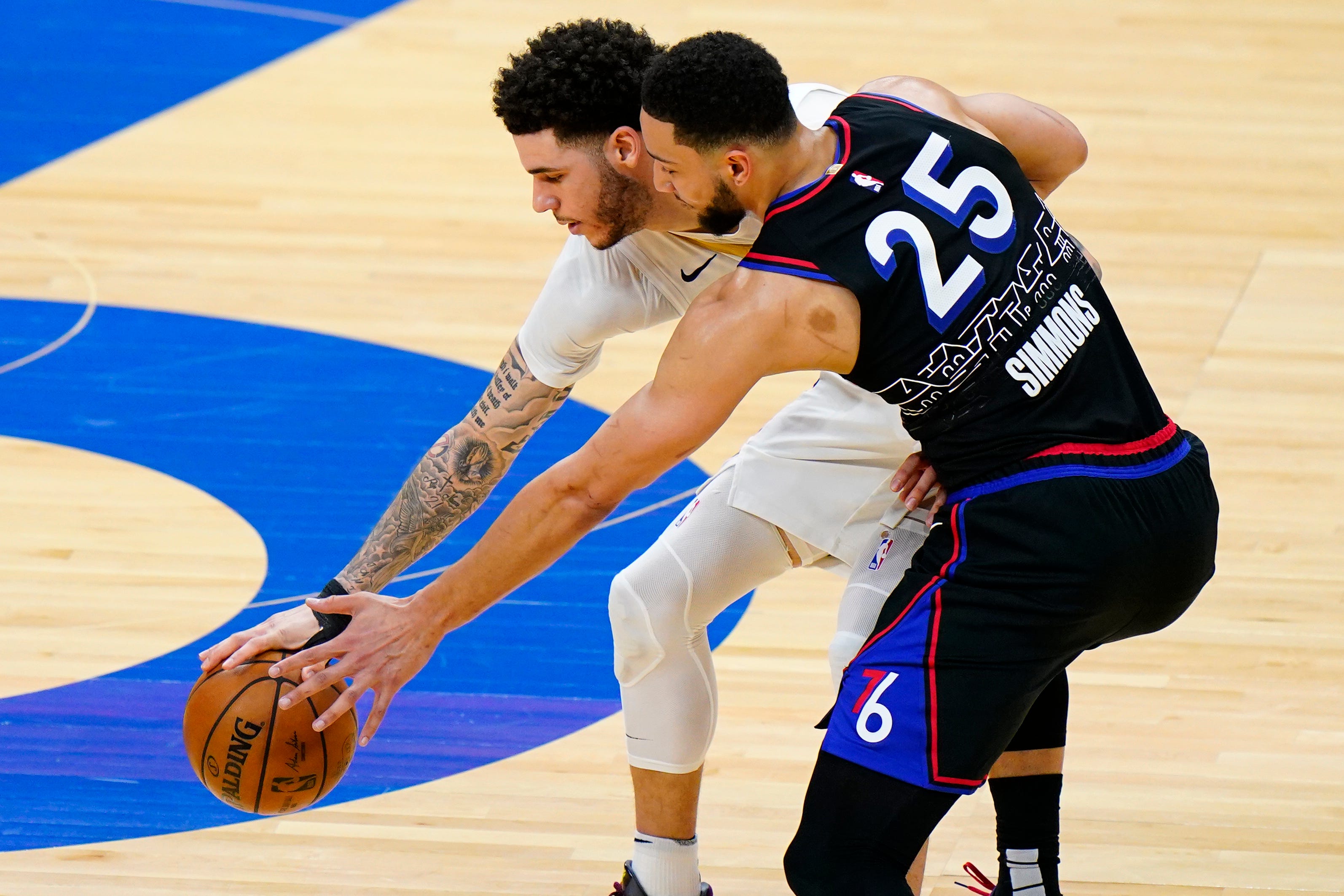 Philadelphia 76ers' Ben Simmons (right) steals the ball from New Orleans Pelicans' Lonzo Ball during the first half of an NBA basketball game, Friday, May 7, 2021, in Philadelphia.