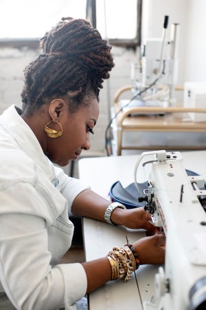 Jovanna Robinson makes travel bags, wallets, handbags, laptop bags and other leather accessories at her Tonē Bekka studio in Franklinton.