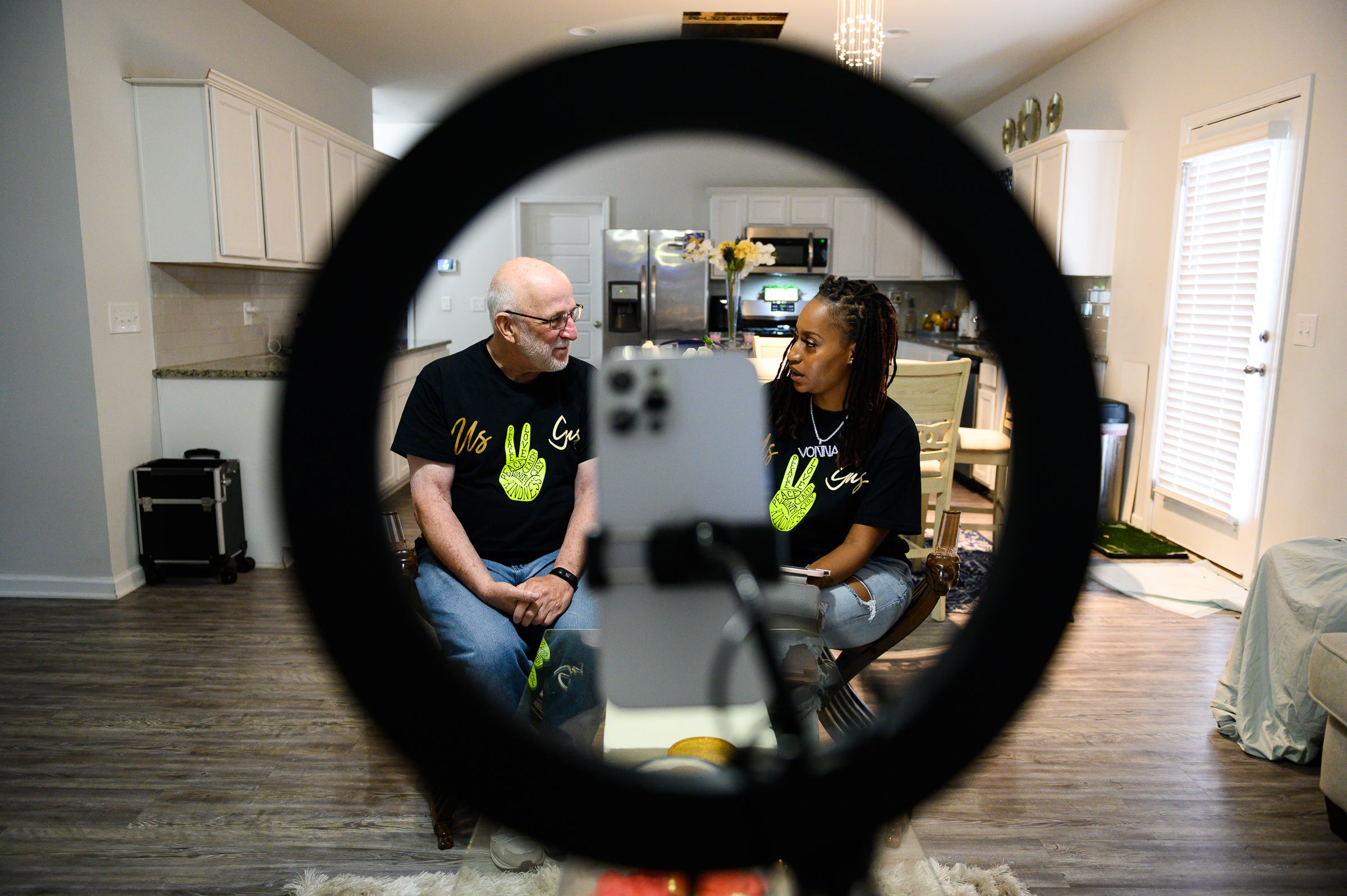Lavonna Goodwin and Gus Philpott talk while doing a Facebook Live for their weekly "Us and Gus" video in Goodwin's Columbia area home.