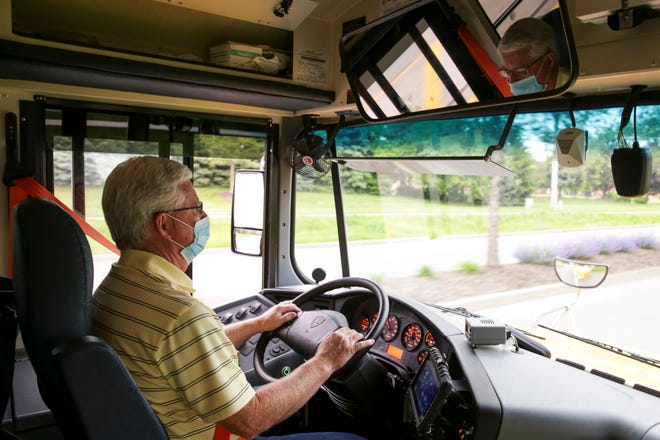 Gary Moore, Tippecanoe School Corp head trainer and bus driver, drives a TSC school bus, Wednesday, May 19, 2021 in Lafayette.
