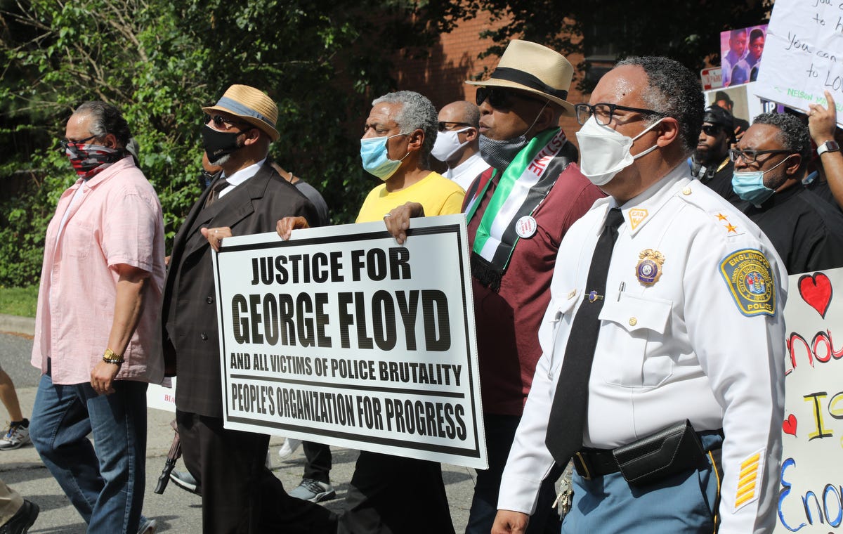 People marched through Englewood, New Jersey on June 6, 2020 to condemn the killing of George Floyd and seeking justice and changes to policing throughout the country. Amongst this group are protest organizer Scott Jenkins of the North Jersey Caucus for Social Justice with Larry Hamm, candidate for U.S. Senate and chair of the People's Organization for Progress and Englewood Police Chief Laurence Suffern.