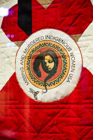 The Star Quilt, part of Turtle Bay Exploration Park's "The Jingle Dress," an exhibit of Native American women's ceremonial clothing. The red jingle dress and dance have been adopted by those at the forefront of the Missing and Murdered Indigenous Women movement.
