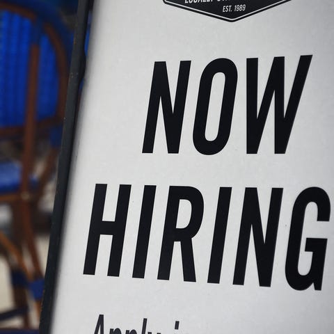 "Now Hiring" sign on Aug. 4, 2020, in Arlington, V