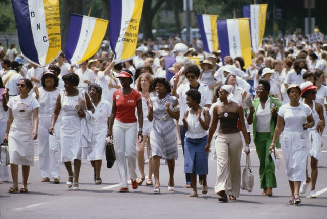 "ERA March on Washington, D.C., 1978" by Arthur Grace welcomes visitors to "On With the Fight," a show about women's activism at the Briscoe Center for American History.