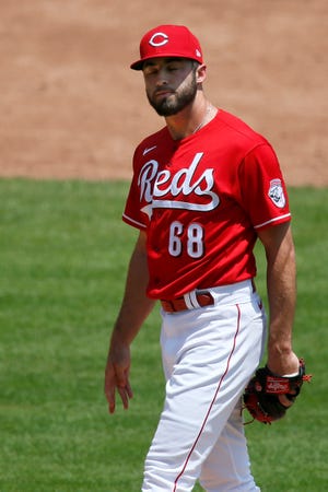 Cincinnati Reds relief pitcher Ryan Hendrix (68) reacts after giving up a home run to San Francisco Giants first baseman Darin Ruf (33) in the third inning of the MLB National League game between the Cincinnati Reds and the San Francisco Giants at Great American Ball Park in downtown Cincinnati on Thursday, May 20, 2021. The Giants led 10-0 after a nine-run third inning.