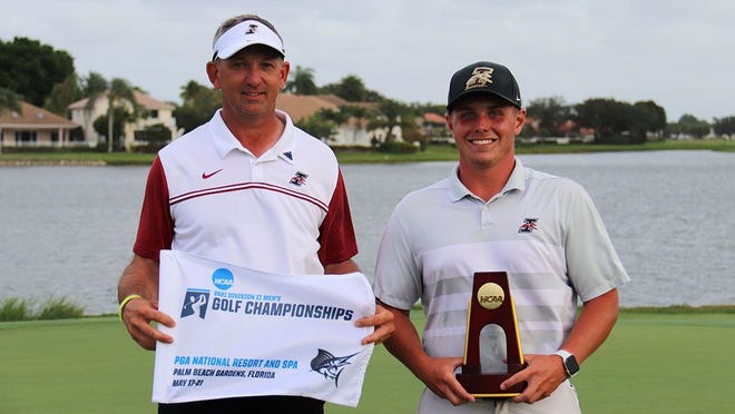 University of Indianapolis golfer Keegan Bronnenberg (right) stands alongside his head coach Brent Nicoson after winning the NCAA Division II individual title on Wednesday, May 19, 2021 at the PGA National Resort in Palm Beach Gardens, Florida.