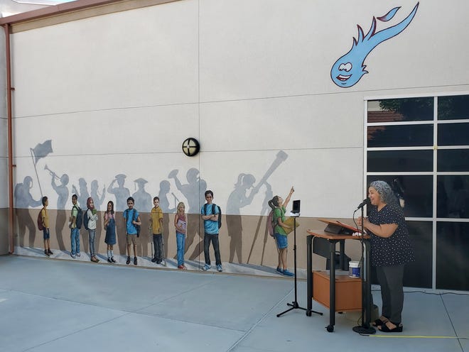 Principal Tiffany Norton dedicates the Dr. Carreon Academy AVID mural by artist Keith Blum on Wednesday in Indio.