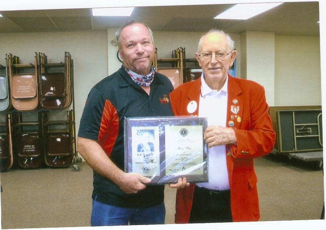 A Dick Bryan Award was presented to Greg Hess, left, by Lion Bill Harner of the Hayesville Lions Club May 20.