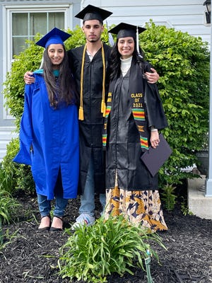 Danya Hamad, of Canal Winchester, right, will graduate from Capital University's law school  this Sunday at the age of 19. It will be the third commencement her family attends this month; her 18-year-old brother David, middle, and 22-year-old sister Summer, right, received bachelor degrees as well from Capital.