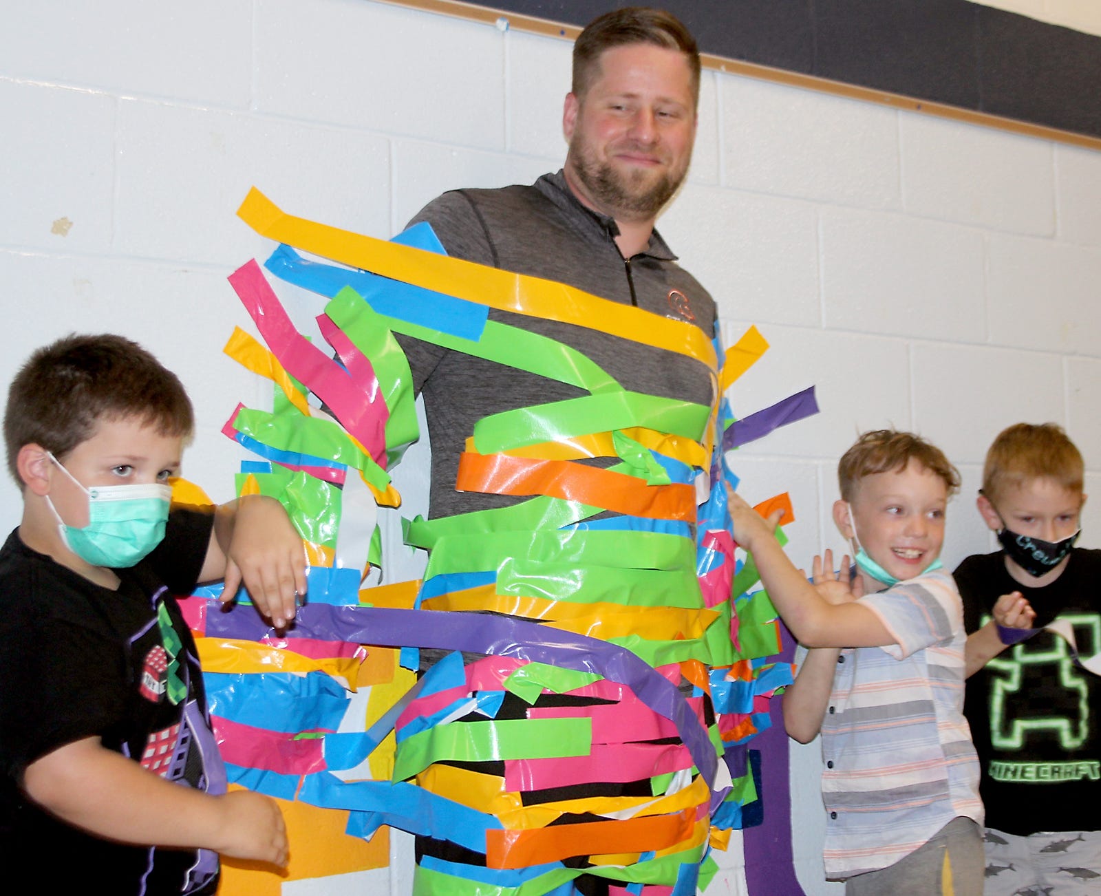 Students at Wenzel Elementary ducttaped their principal to the gymnasium wall.