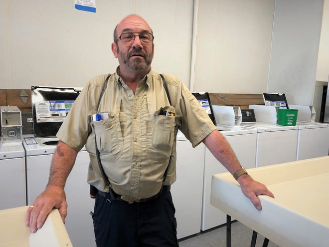 Scot Sauer, owner of Surf N Suds laundromat in Newark's Park N Shop shopping center on South Main Street, will not require masks in his business. "I'm super glad it's finally ending," Sauer said.