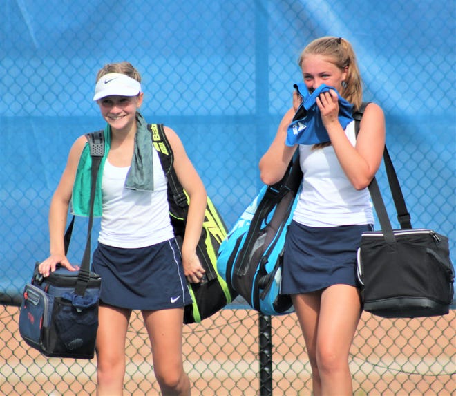 Notre Dame teammates Lauren Janzaruk, left, and Taylor Meenach after winning the doubles championship during the KHSAA 9th Region girls tennis championships May 21, 2021, at Notre Dame Academy.