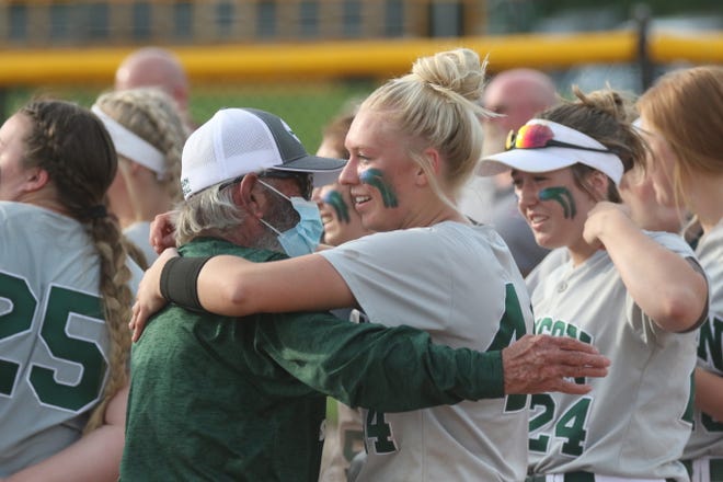 Madison's Hope Barrett embraces the late Willy Harper after the Rams won the Division II district championship last season.