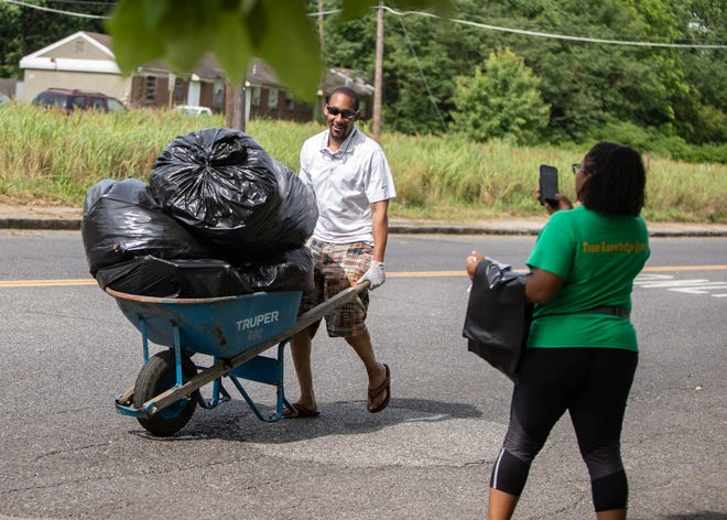 Memphis River Parks Partnership volunteers  clean up around Vance Avenue, Saturday May 22, 2021.