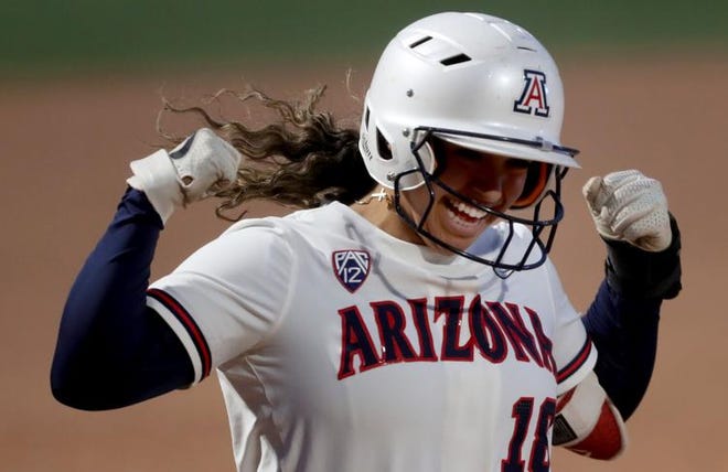 Arizona's Sharlize Palacios (18) comes home strong after whacking an opposite field two RBI homer to right against UMBC in the fifth inning of their NCAA opening regional game at Hillenbrand Stadium, Tucson, Ariz., May 21, 2021.