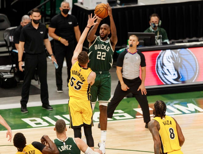 Khris Middleton overtime shot lifts Milwaukee Bucks over Miami Heat