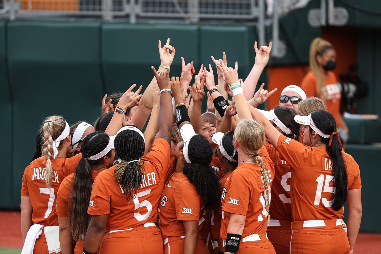 Texas' softball players huddle up to celebrate their 6-0 victory over Texas State on Saturday in the NCAA Austin Regional.