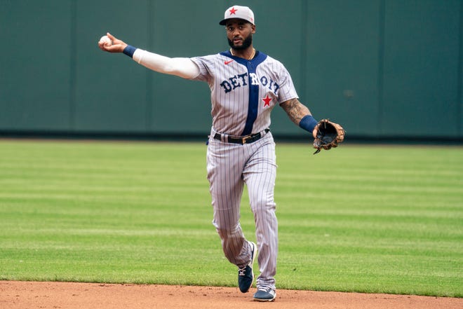 Niko Goodrum of the Detroit Tigers throws a Kansas City Royals runner out at first base in the first inning at Kauffman Stadium on May 23, 2021 in Kansas City, Missouri.