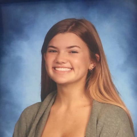 A yearbook photo of Riley O'Keefe, a student at Ba