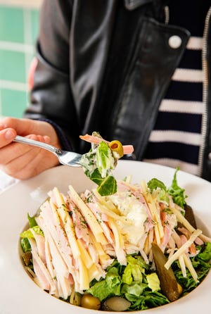 The Hudson salad at Hudson Cafe is piled high with ham, turkey and Swiss cheese.