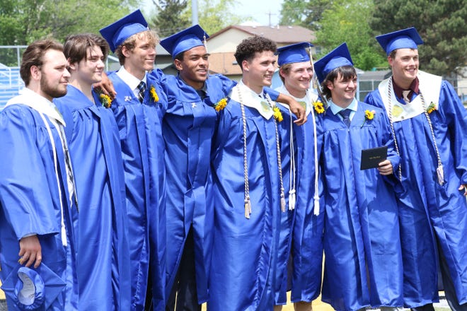 Friends celebrate with a group photo after the 2021 Clyde Graduation, held on Sunday, May 23.