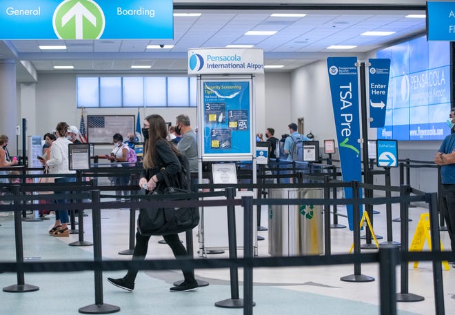 Passengers go through security screening Monday at the Pensacola International Airport. City officials are considering expanding the terminal at the airport as daily travel numbers start to rise above pre-pandemic levels.
