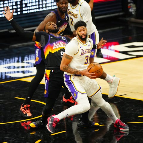 Los Angeles Lakers forward Anthony Davis controls 