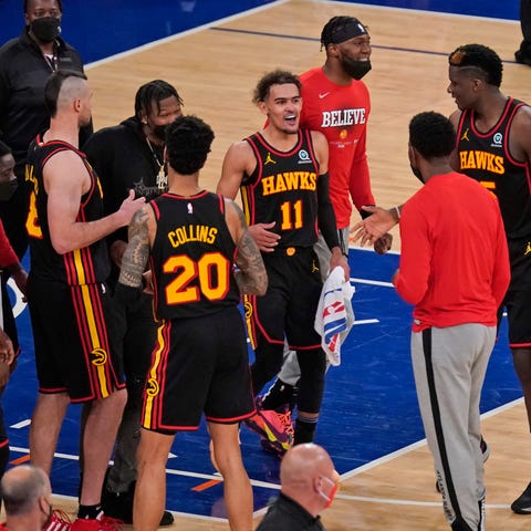 Trae Young and the Atlanta Hawks celebrate their G
