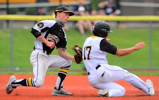 Quaker Valley's Ethan Faris tags out Montour's Brock Janeda in the first inning. [Lucy Schaly/For BCT]