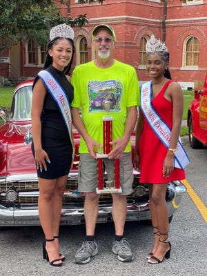 Jon and Kathleen Bagala won first place in the classic car division of the car show held in Donaldsonville. Jon Bagala is pictured with Miss Donaldsonville Gabrielle Johnson and Miss Teen Donaldsonville JaKayla Landry.