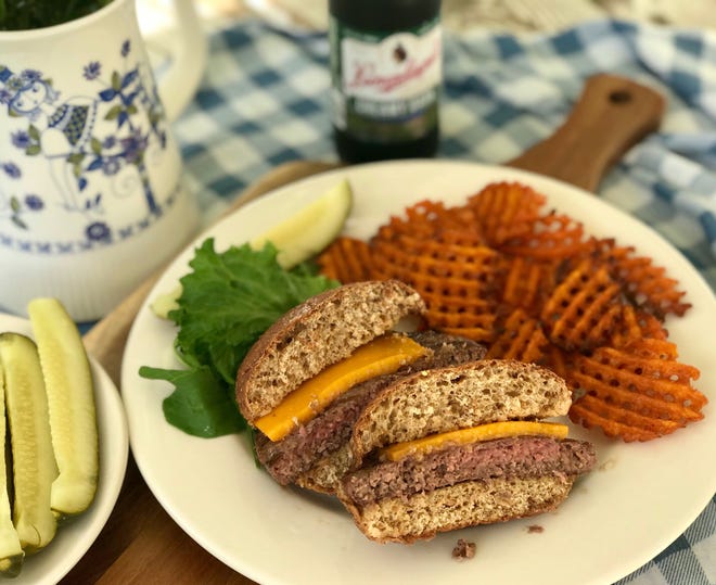 This Wisconsin-themed cookout plate includes a prime rib burger from Ney's Premium Meats in Hartford, topped with a sharp cheddar from Hook's Cheese in Mineral Point on a sprouted whole grain bun from Angelic Bakehouse in Cudahy.