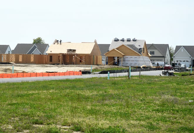 Homes are built Wednesday, April 28, 2021, in Delaware.