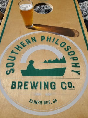 A recent visit to Southern Philosophy in Bainbridge, Georgia, included dining in the outdoor courtyard full of games like cornhole and a giant Connect Four board.