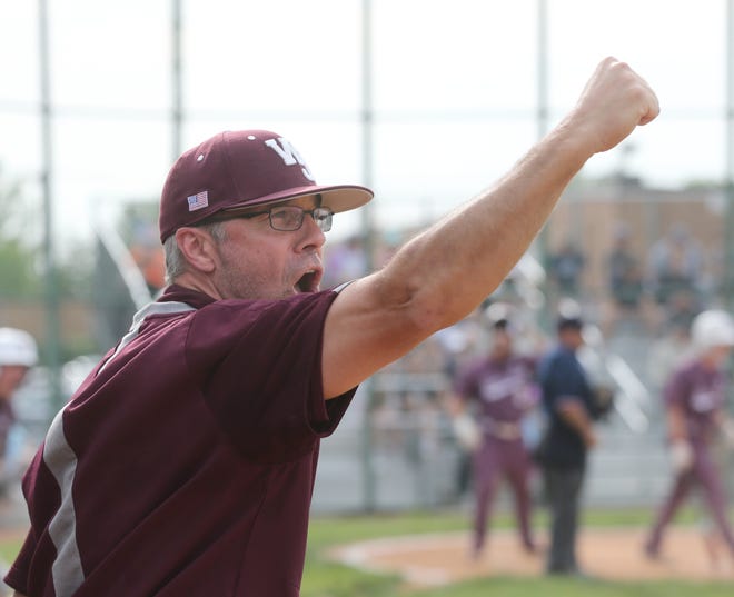 Walsh Jesuit head coach Chris Kaczmar celebrates during a six-run first inning against Hudson in a Division I district semifinal, Tuesday, May 25, 2021 in Euclid.