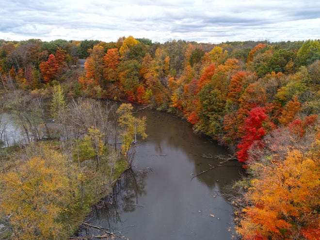 The Kalamazoo River is seen from overheard in this file photo. The state of Michigan sued the owner and operator of a hydroelectric dam, alleging that its mismanaged drawdown of a lake to do repairs created sediment that has choked a 30-mile stretch of the river, impeded recreational use and threatened public safety.