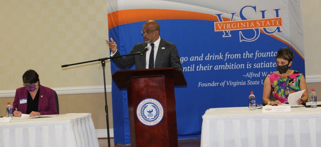 Dr. Makola Abdullah, President, Virginia State University speaks with a Town Hall Meeting attendee at VSU on May 26, 2021.