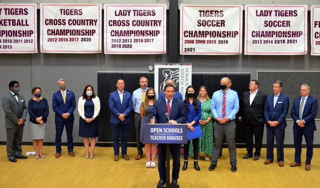 Gov. Ron DeSantis makes a announcement about teacher bonuses at Sarasota School of Arts & Sciences gymnasium on Wednesday afternoon during a press conference in Sarasota, Florida, on May 26, 2021.