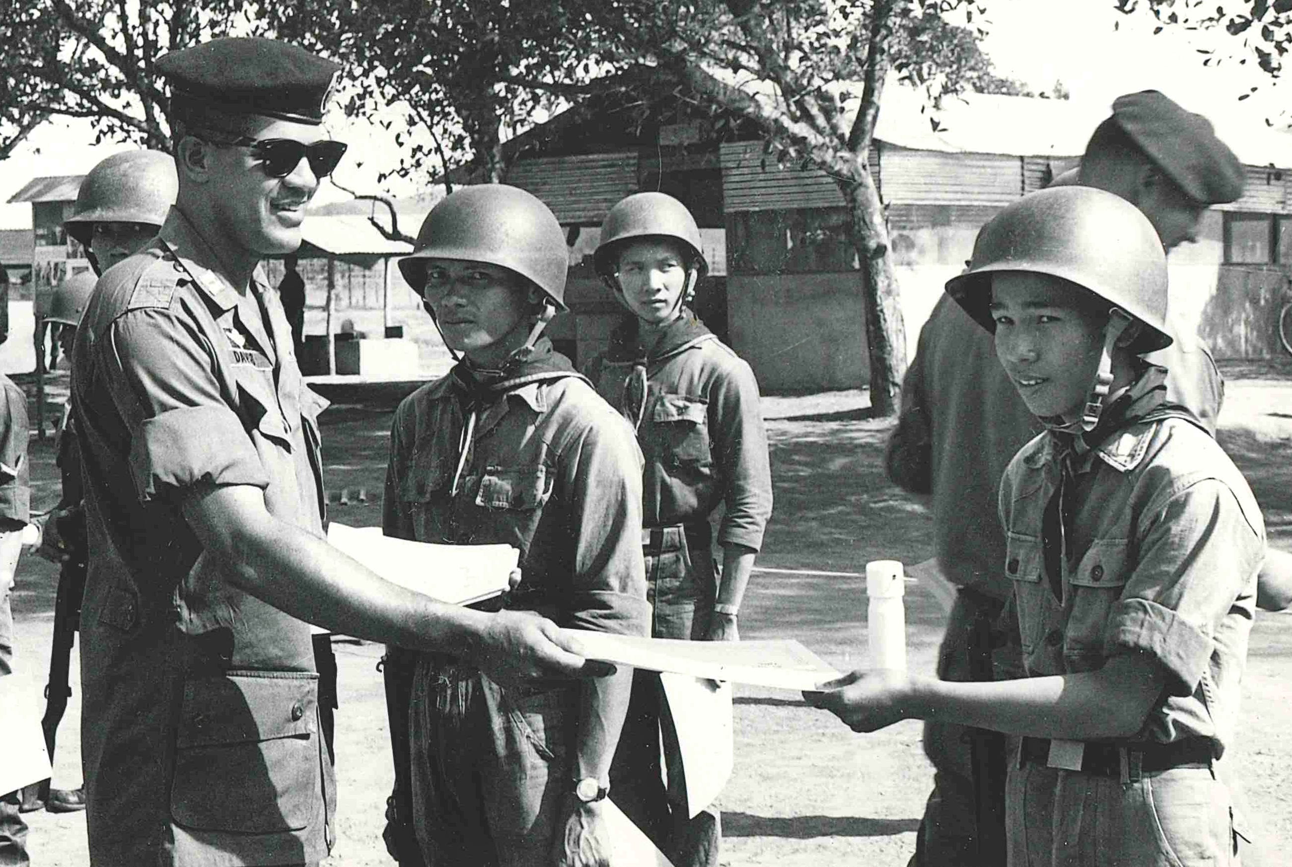 Then-Capt. Paris D. Davis in South Vietnam, during the war, with soldier trainees.