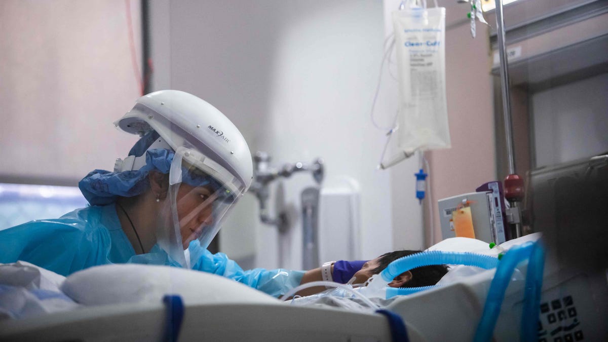 Registered nurse Yeni Sandoval caring for a COVID patient in the ICU at Providence Cedars-Sinai Tarzana Medical Center in Tarzana, Calif., on Jan. 3, 2021.