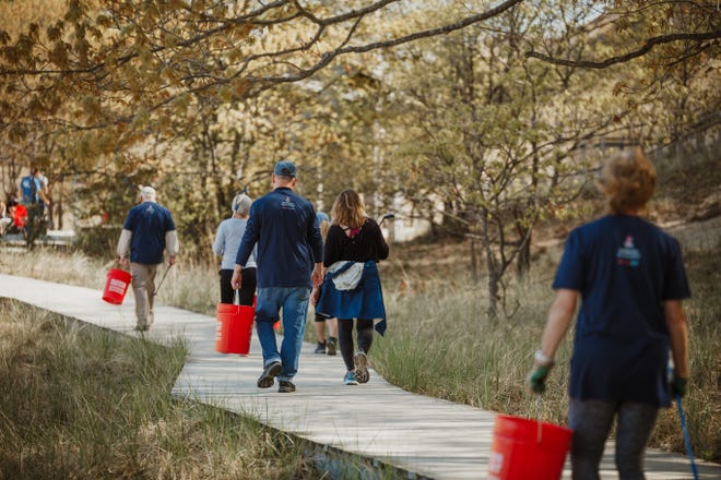 To celebrate its anniversary, the Grand Haven Area Community Foundation kicked off a slate of celebratory activities with a day of giving back. Throughout the day, more than 50 volunteers helped maintain gardens, trails and natural habitats.